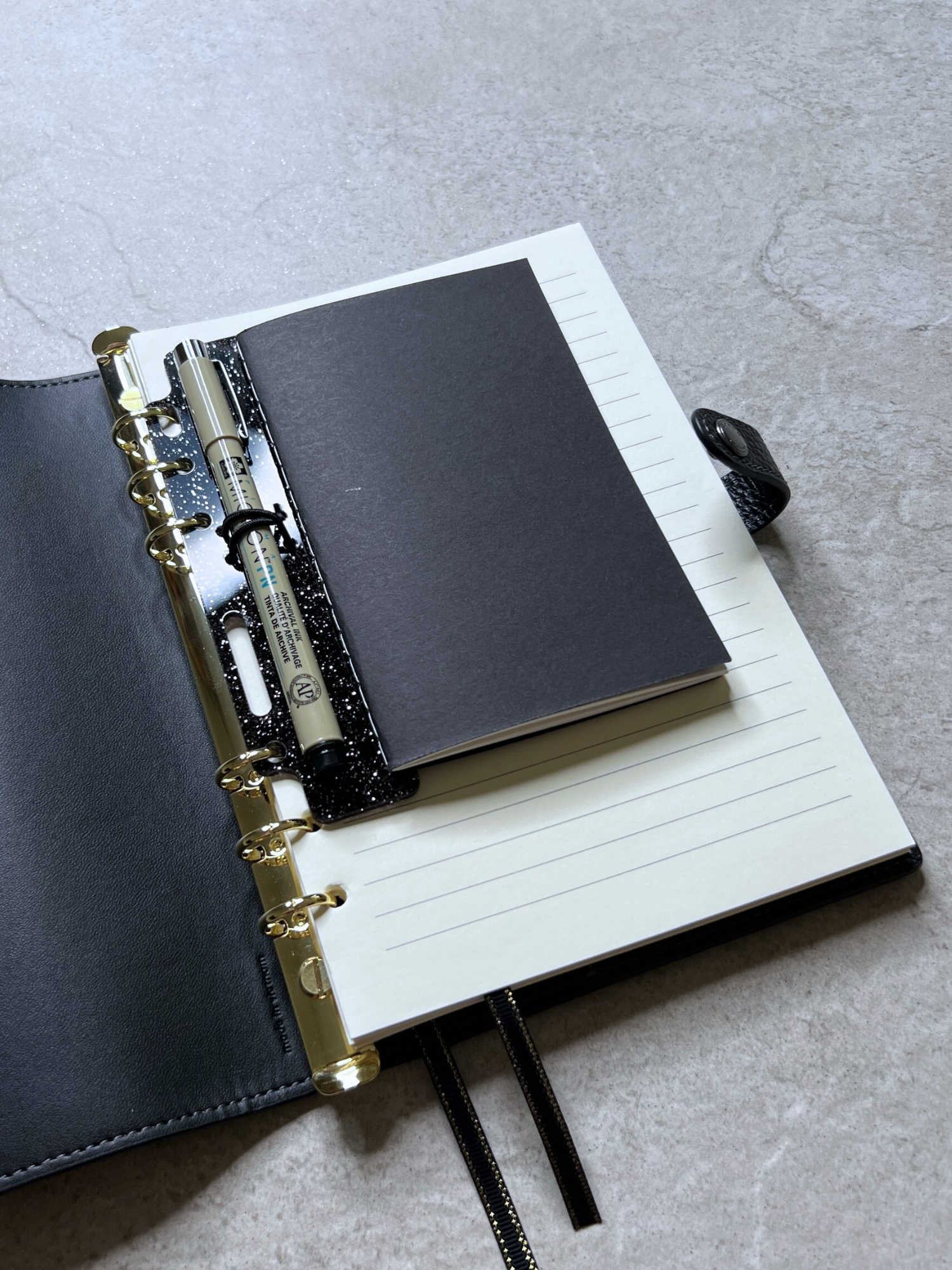 shown in a coach notebook options pop in planners pen and pocket notes holder
